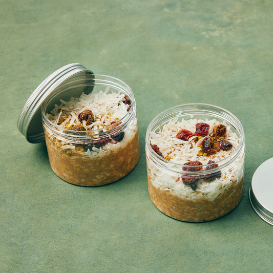 overnight oats cups with toasted pistachio, coconut, and dried sour cherries